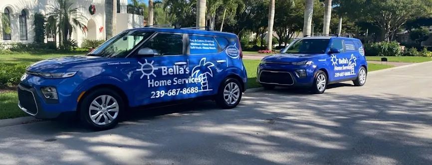 Bella's Home Services branded vans parked in the driveway of a Southwest Florida home